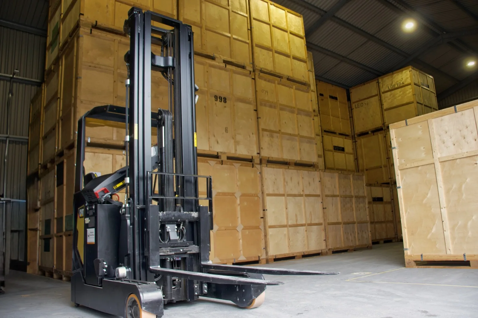 Forklift handling a containerised storage unit on a Horsham house move
