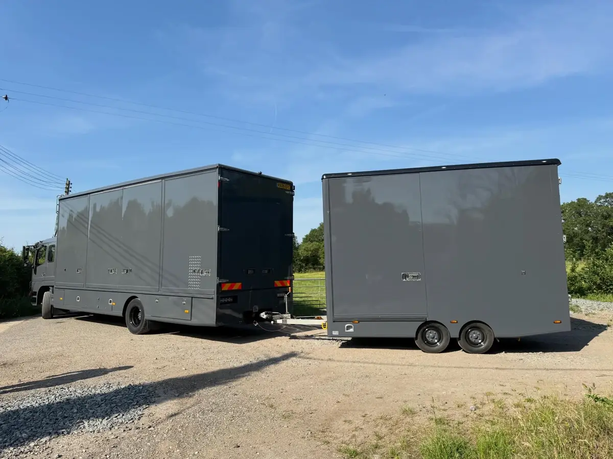 A Wolves Removals lorry and drawbar trailer loaded and ready to move an antiques collection