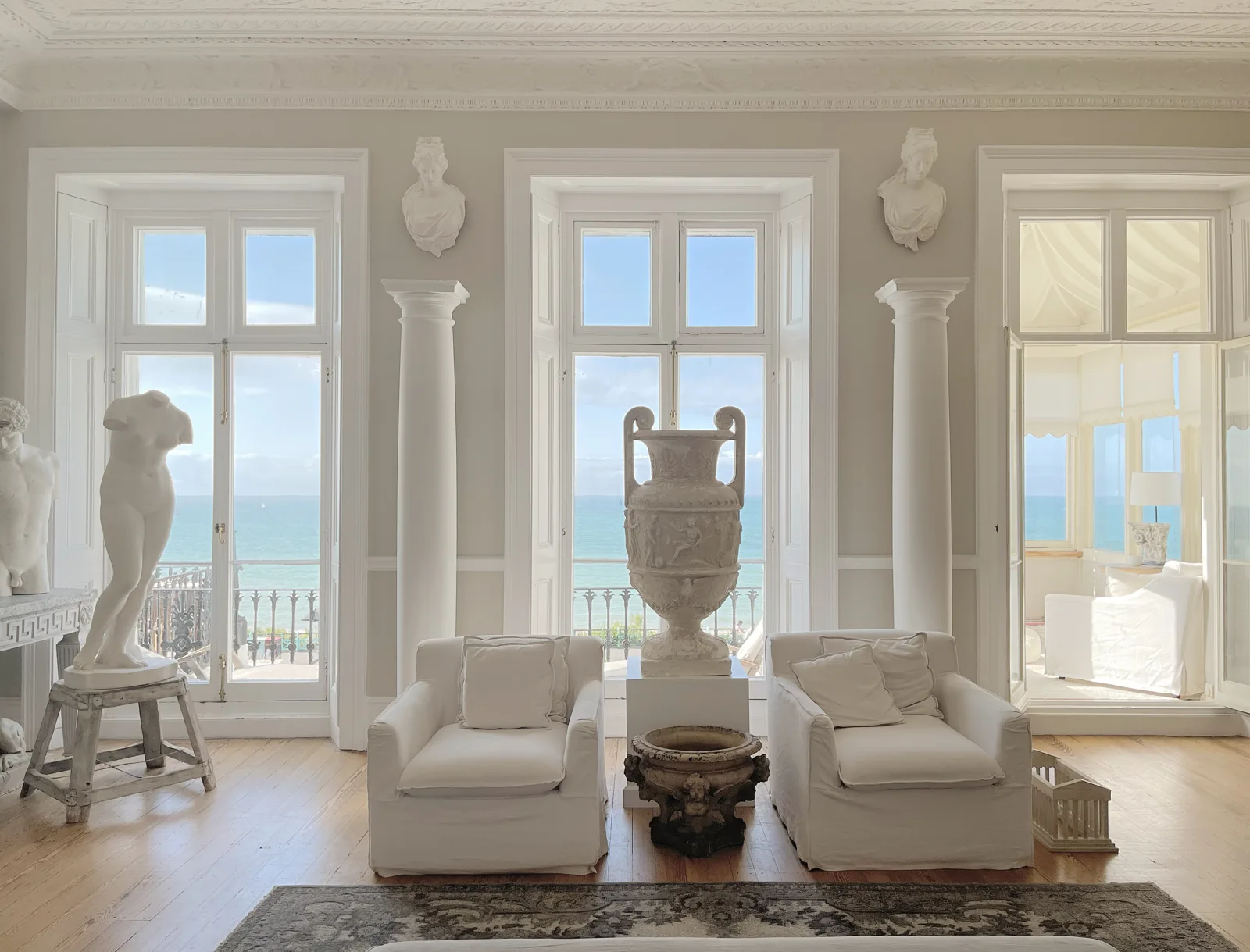 Grand room of antiques and statues with a sea view on a Hampshire house move