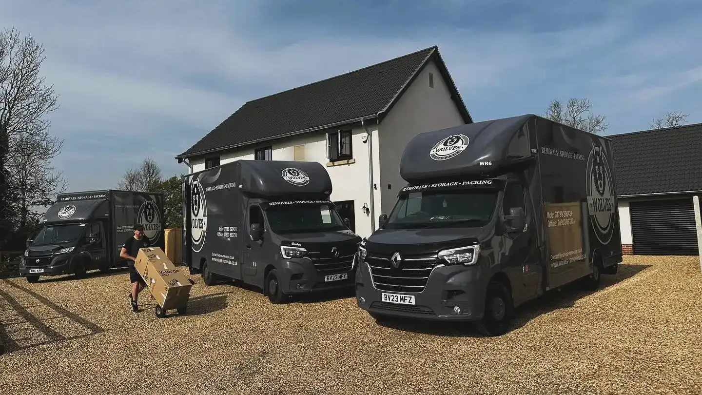 Three Wolves Removals vans outside a house at the end of a Billingshurst to Norfolk removal