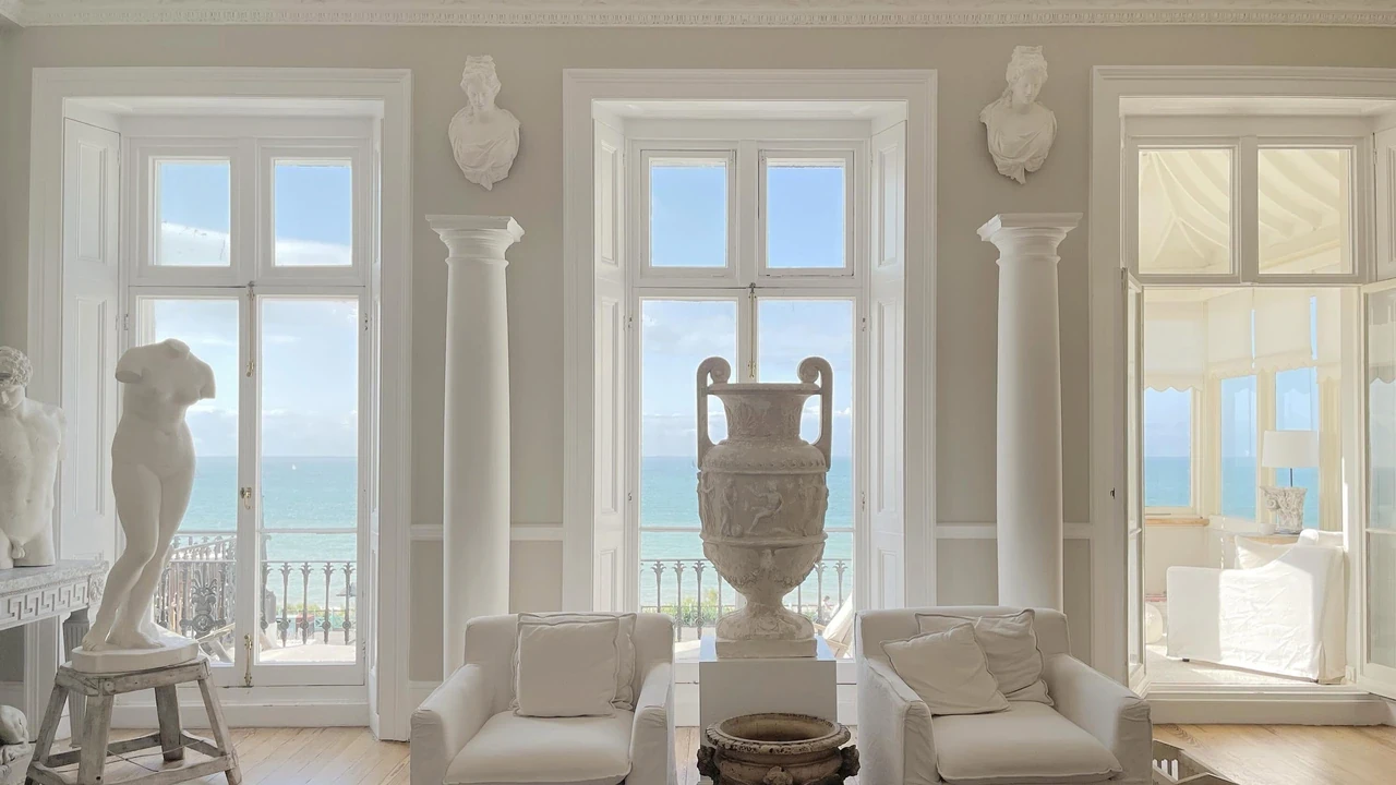 A Brighton seafront drawing room filled with classical sculpture after an antiques move