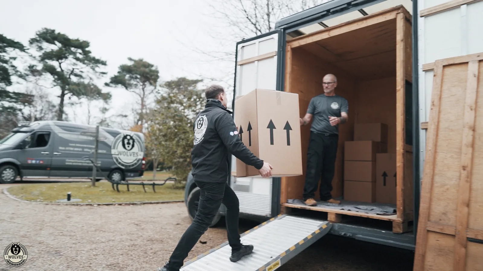 Carrying boxes into barn van