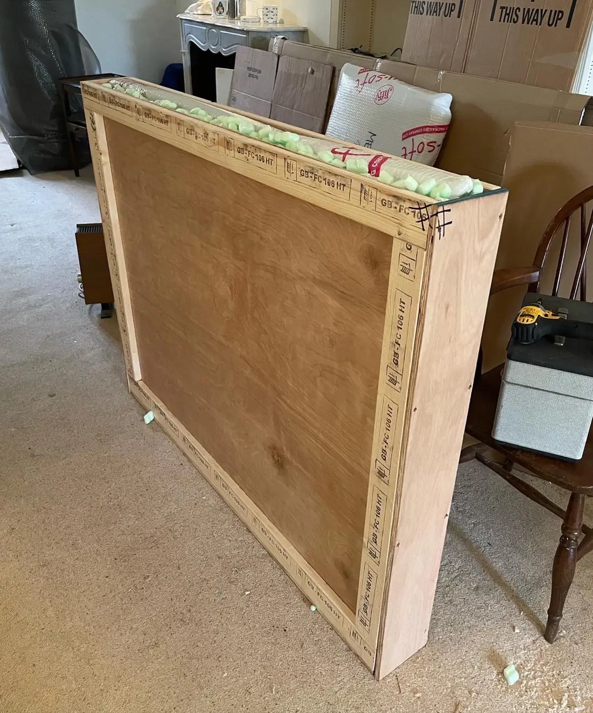 Large wooden crate holding a framed item during a move in Pulborough, West Sussex