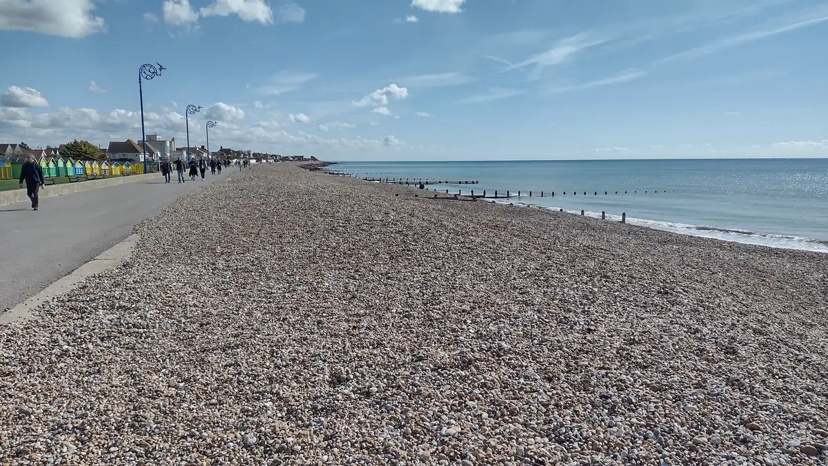 The promenade at Felpham curving past a wide shingle beach