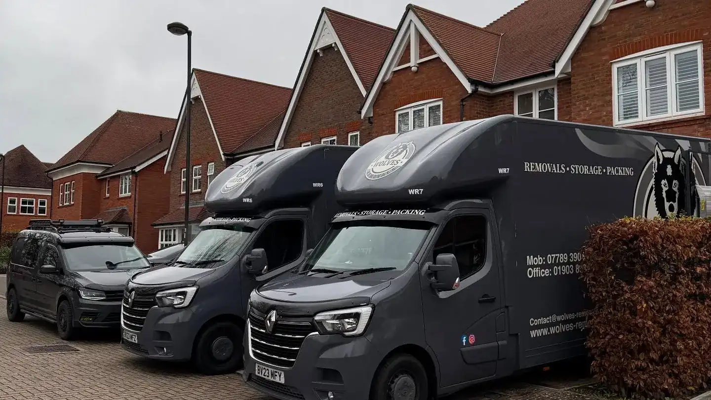 Wolves Removals vans outside a house during a three-day full-service move in Horsham
