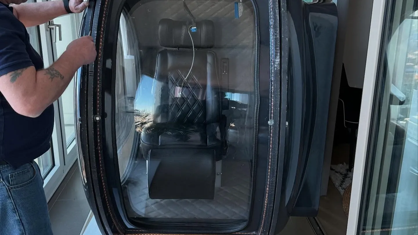 A hyperbaric oxygen chamber being dismantled in a high-rise central London apartment