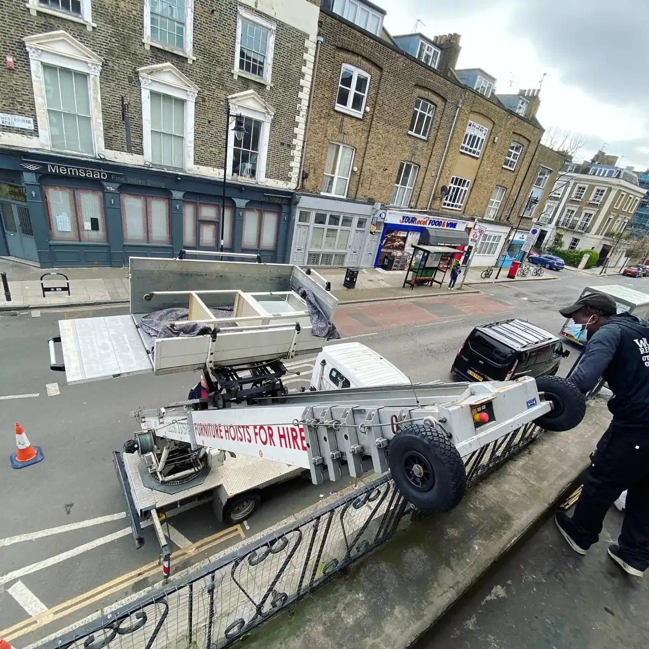 A Wolves Removals crew loading furniture into a van for a man-and-van move