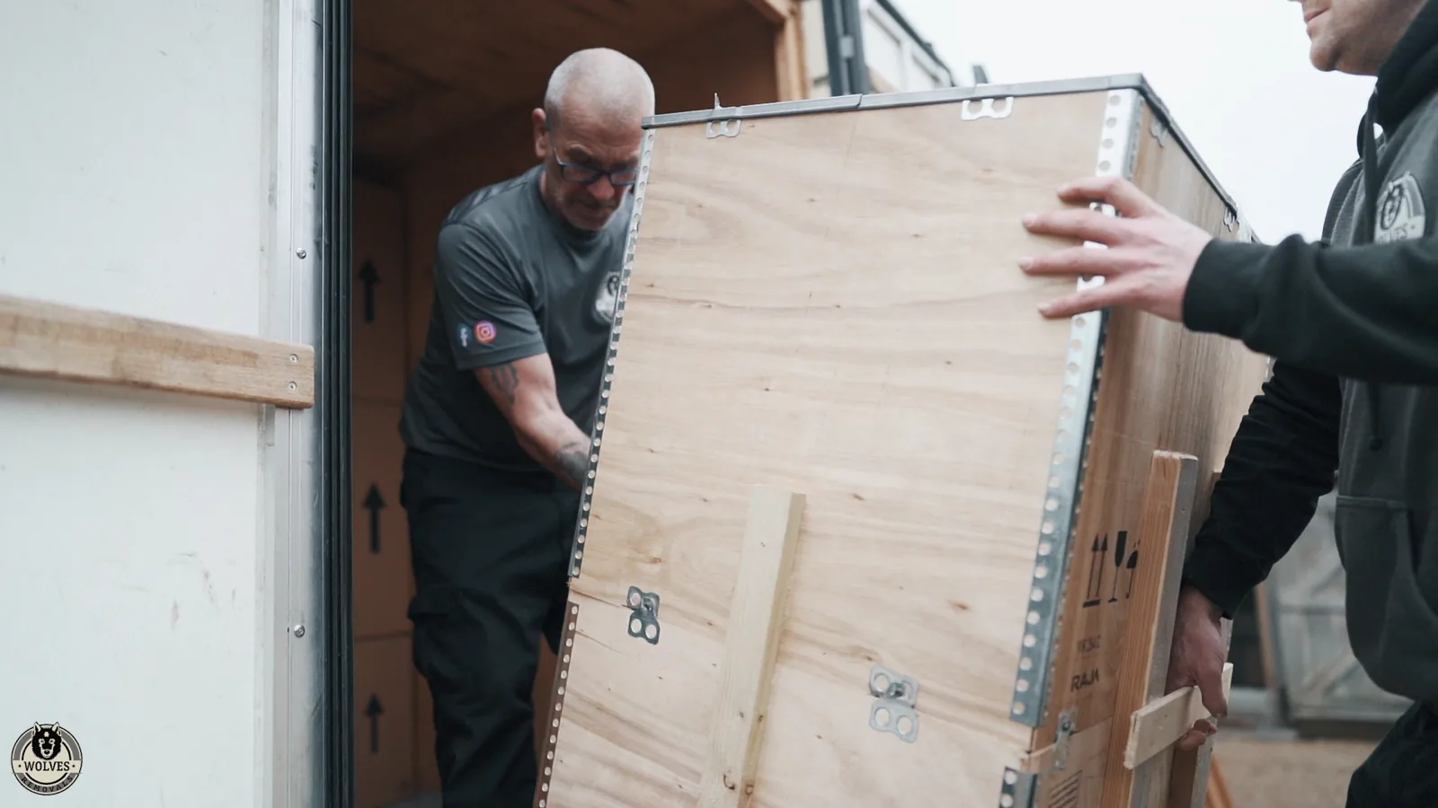 Loading wooden crate into container
