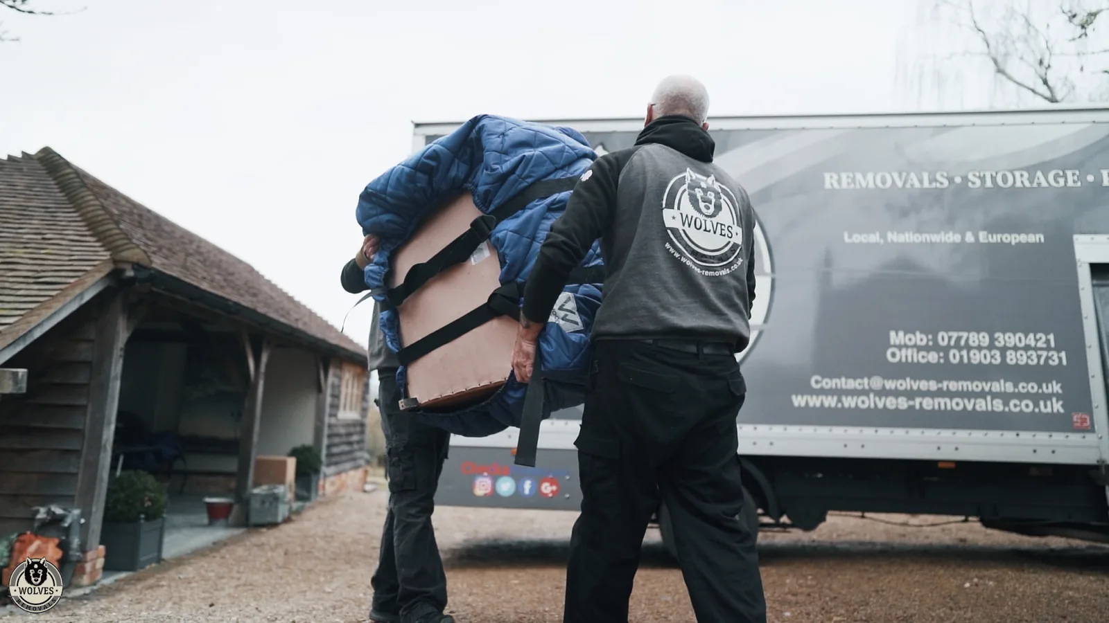 Loading wrapped furniture onto lorry