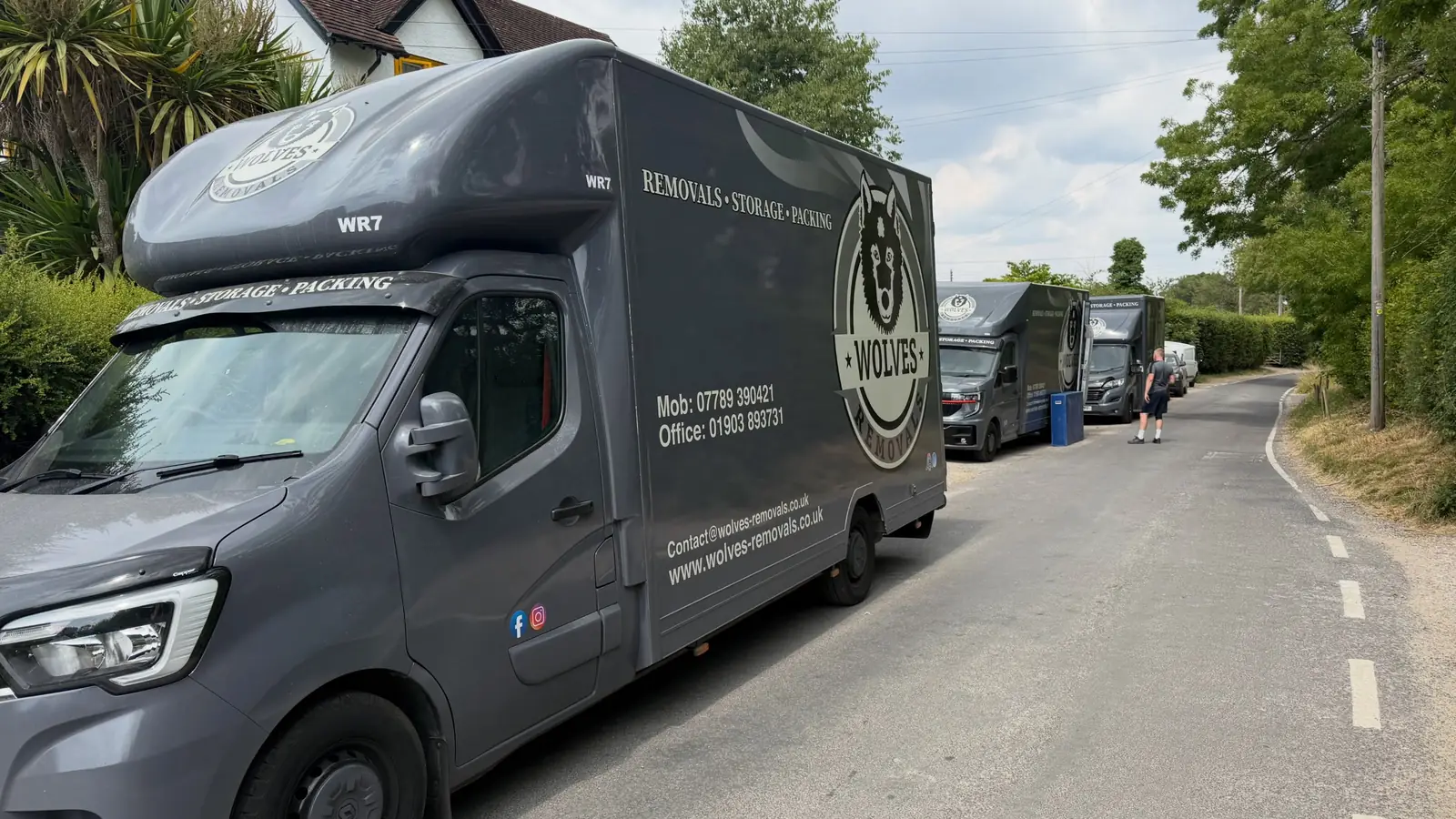 Three Wolves Removals lorries loading on a narrow lane near Midhurst for a long distance move