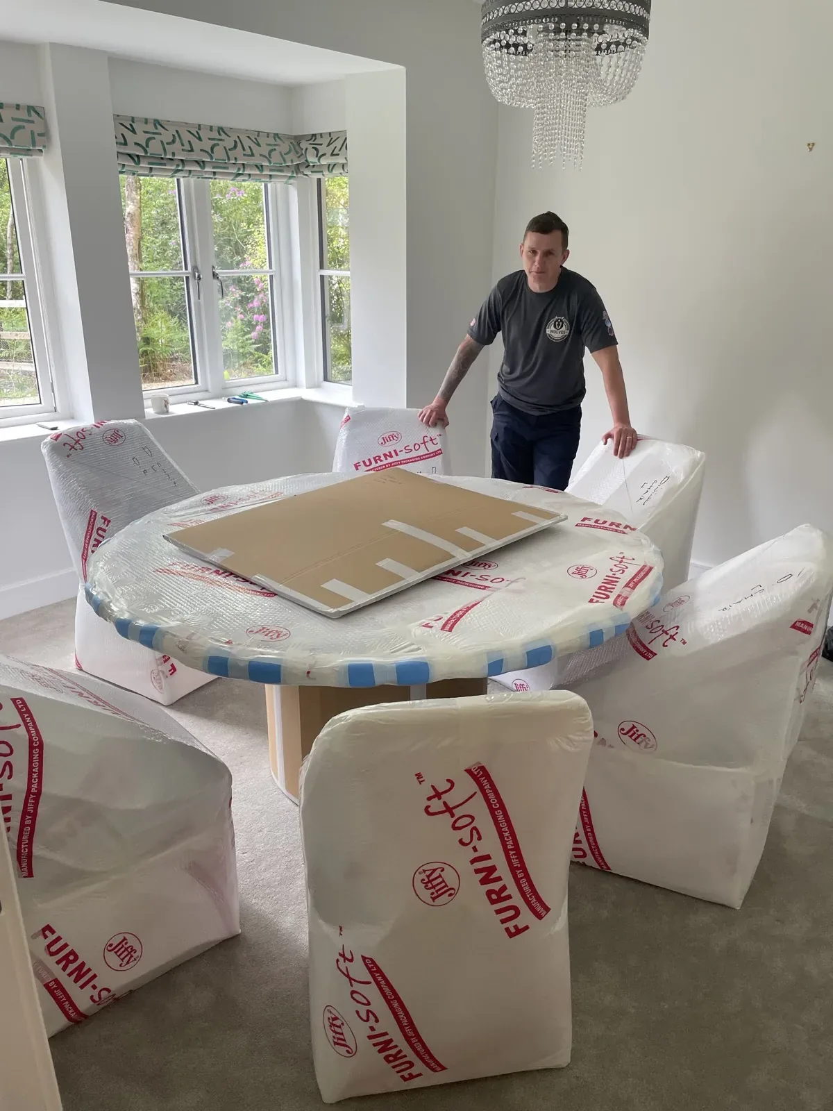 A mover with a wrapped dining set in Horsham