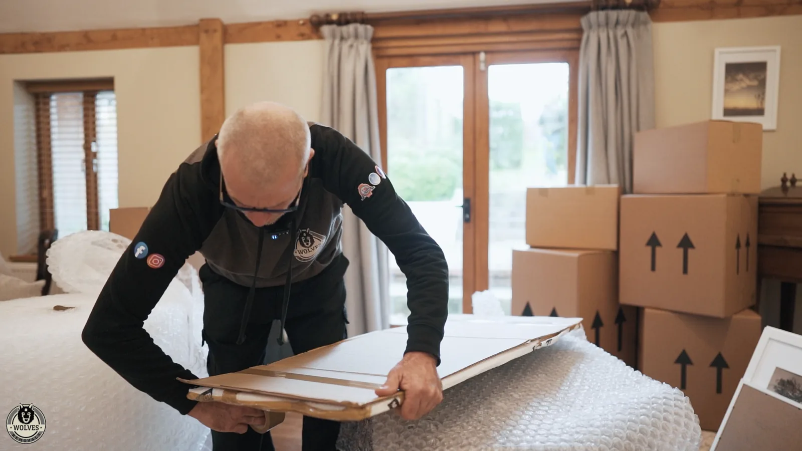 Packing furniture boxes in lounge
