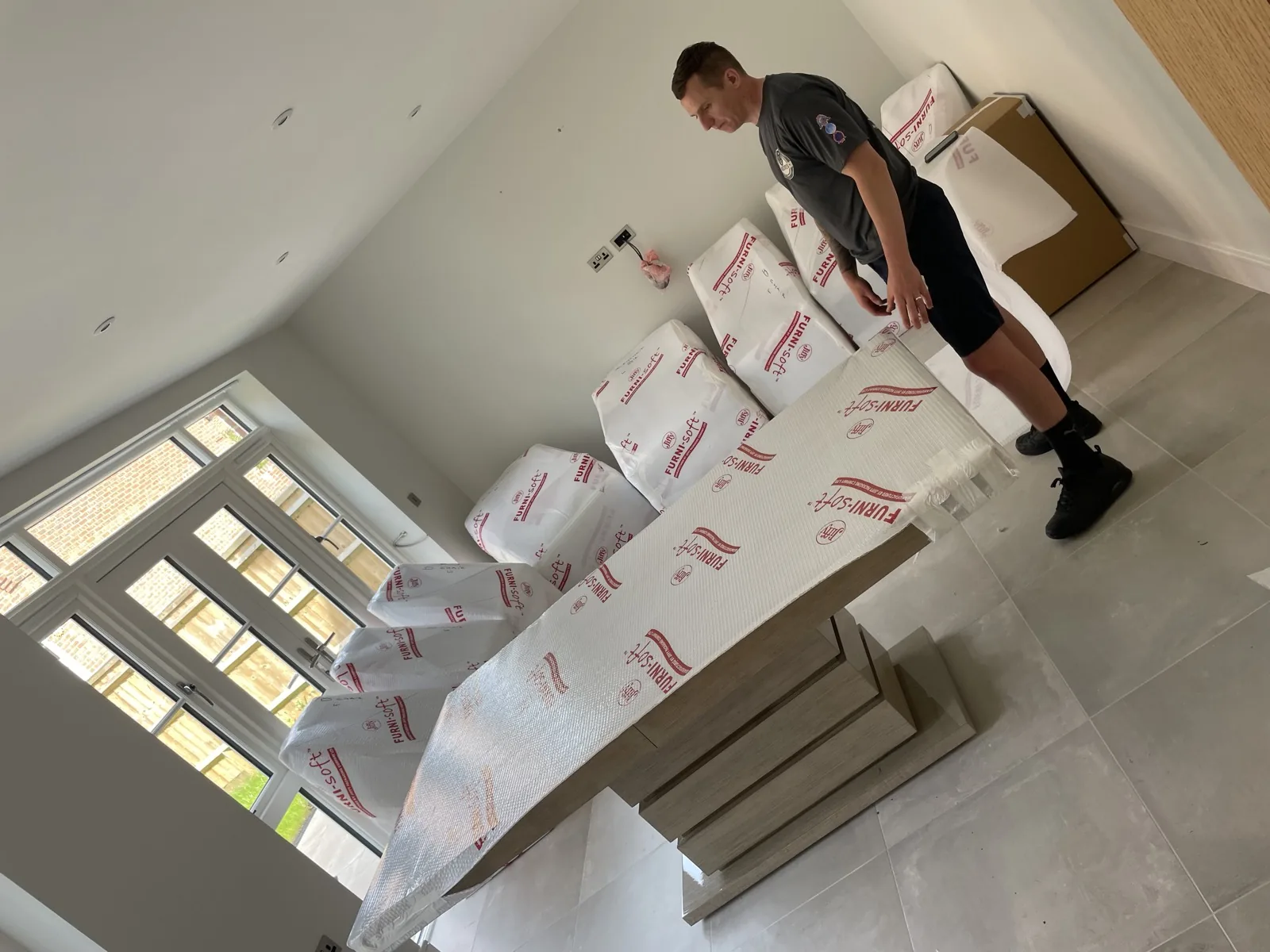 Packing furniture in an attic bedroom for a move in Horsham, West Sussex