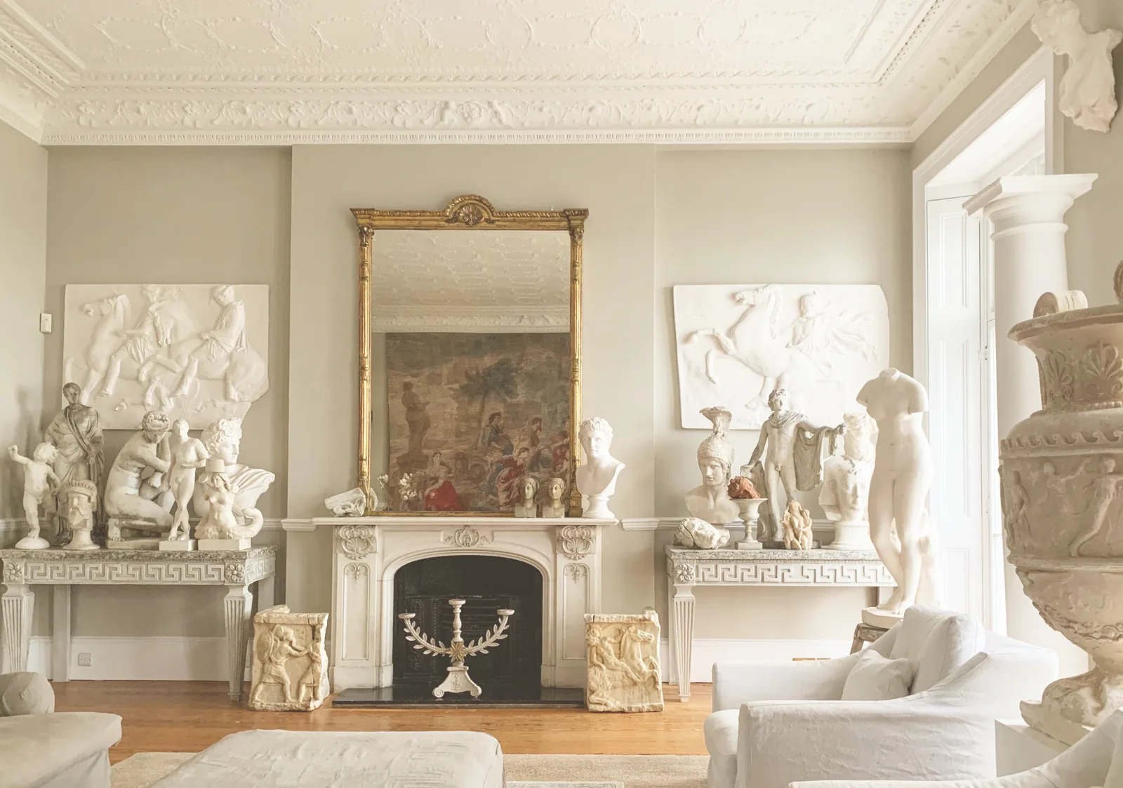 Period room with a marble fireplace and antiques for a Horsham removal