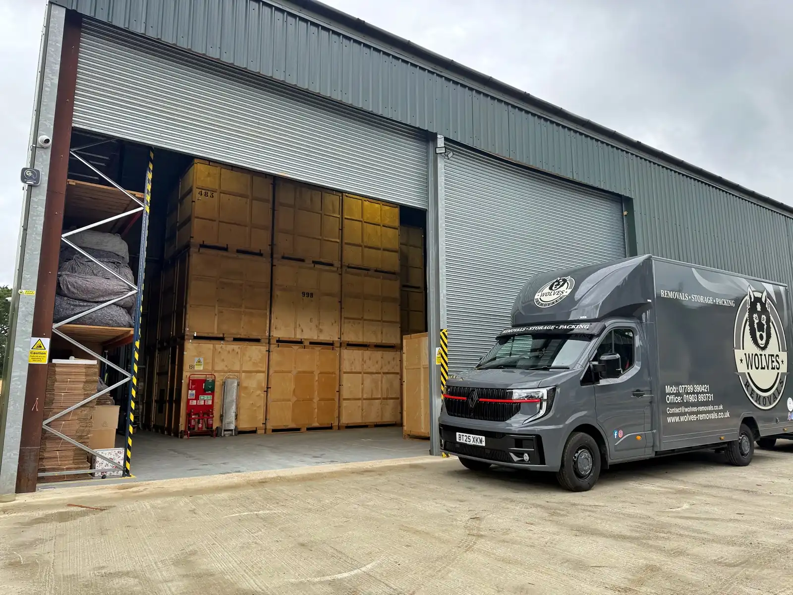A Wolves Removals van beside secure storage containers for student storage