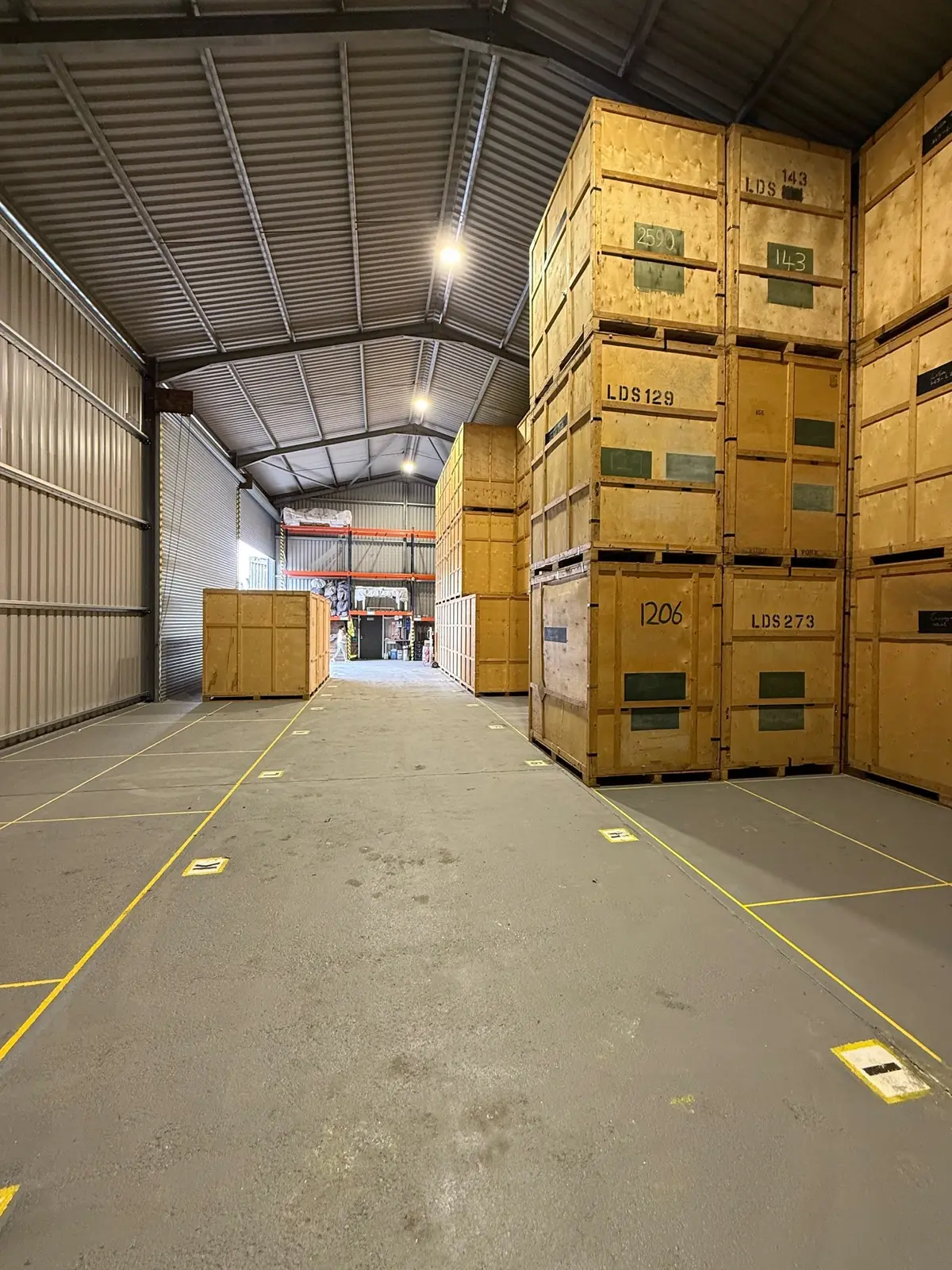 Wooden containerised storage units in the Wolves Removals Sussex store