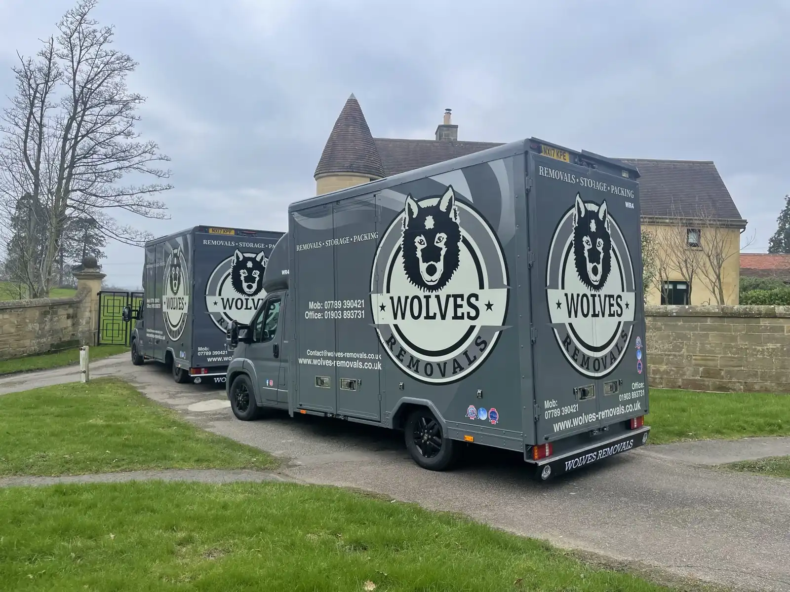 Two removal lorries residential street