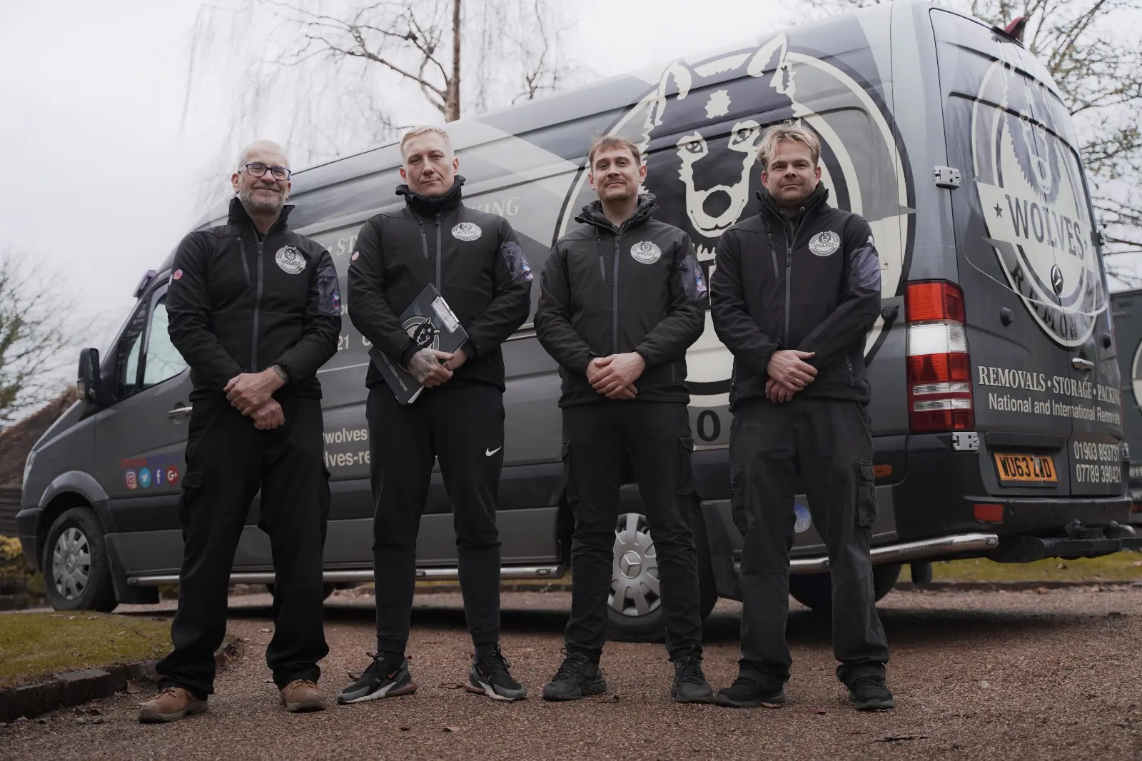 Wolves crew team beside the vans — a Cranleigh removal