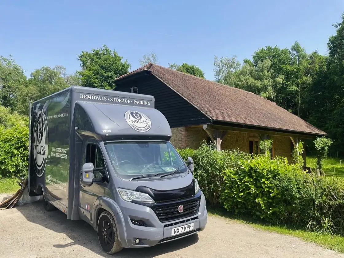 A Wolves Removals van outside a customer's home