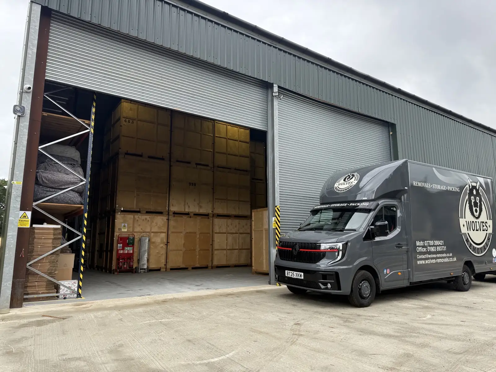 A Wolves Removals van outside the containerised storage warehouse in Sussex