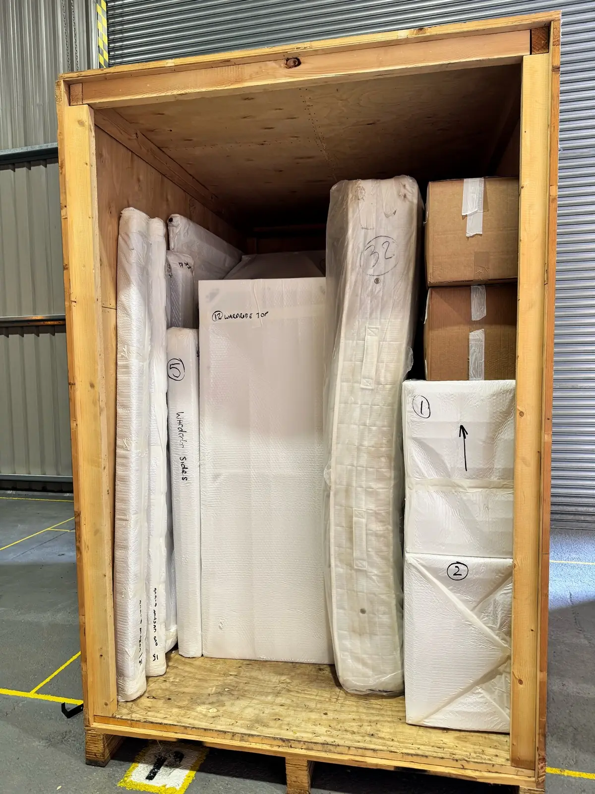 Wooden crate packed with wrapped antiques — a Horsham removal