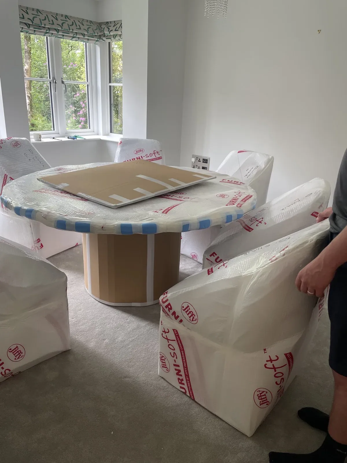 Wrapped dining table and chairs