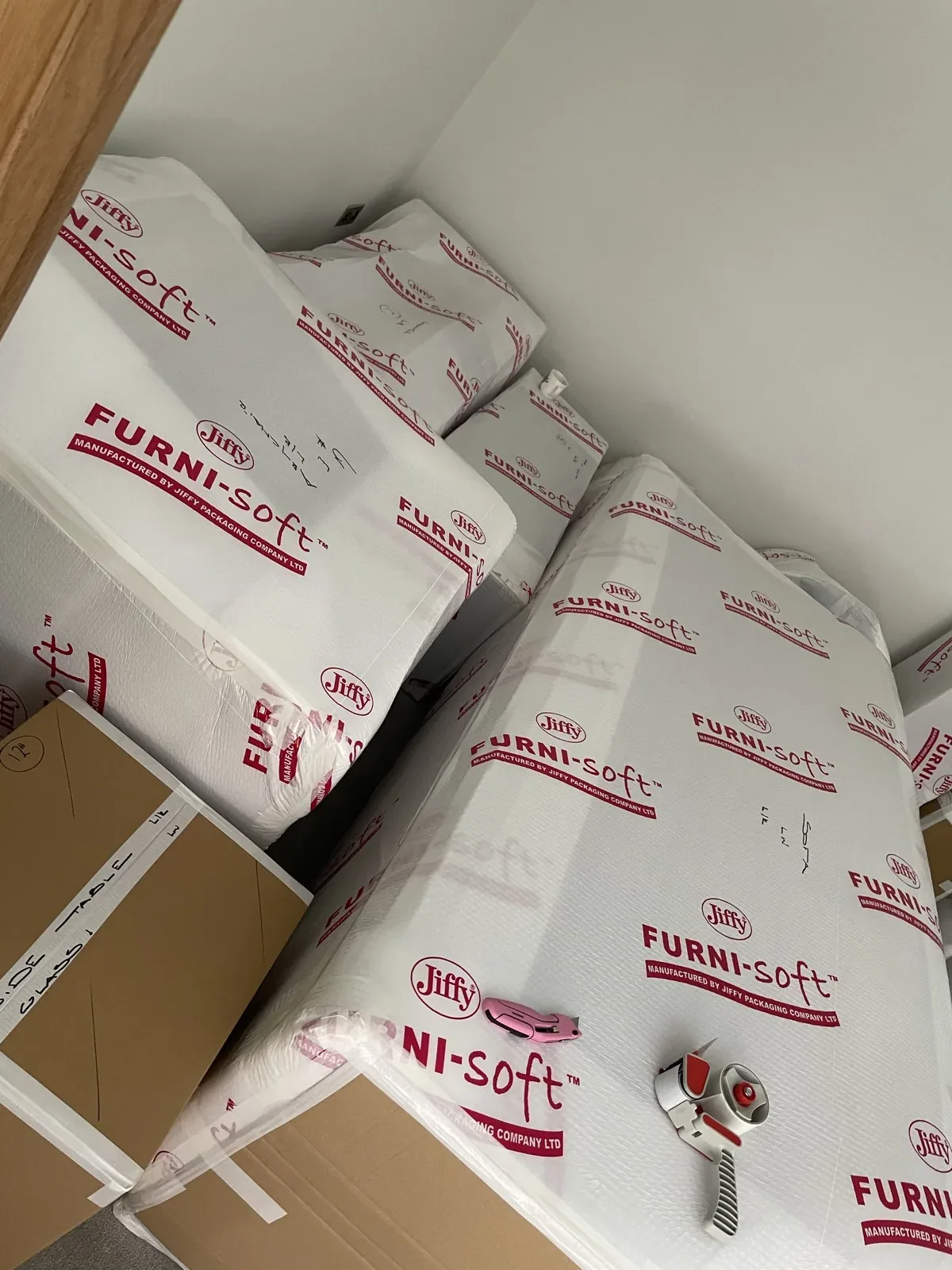 Furniture wrapped in protective covers ready to move