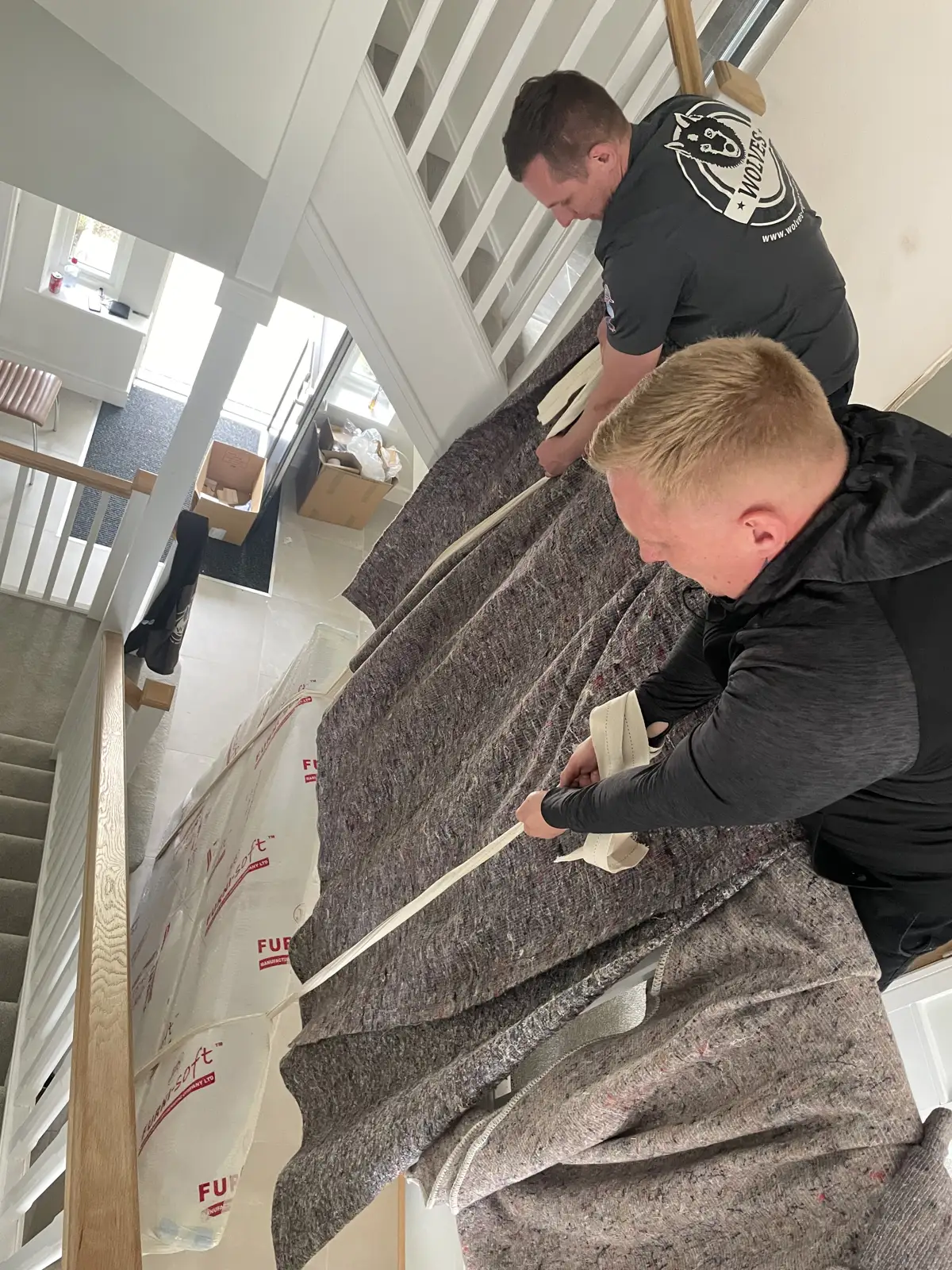 Wrapping a large item on the stairs