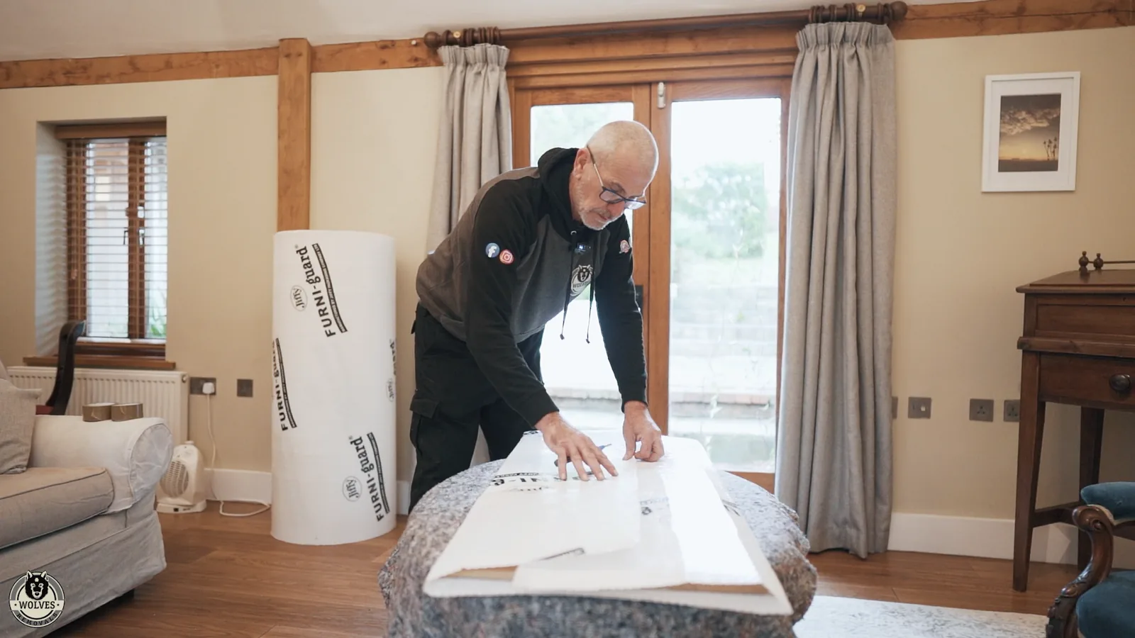 Wrapping living-room furniture on a house move in Horsham