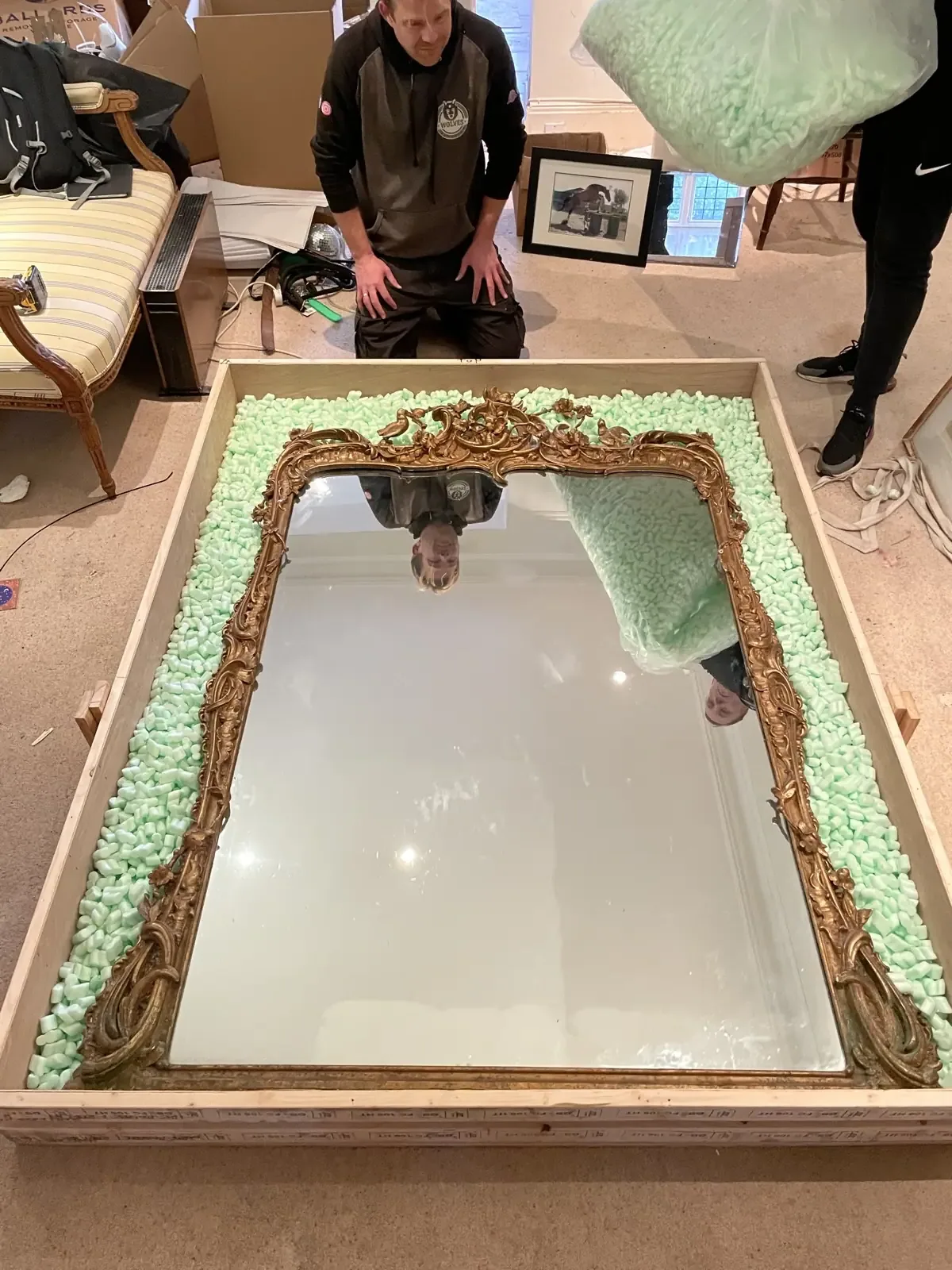Wrapping ornate gilt framed mirror