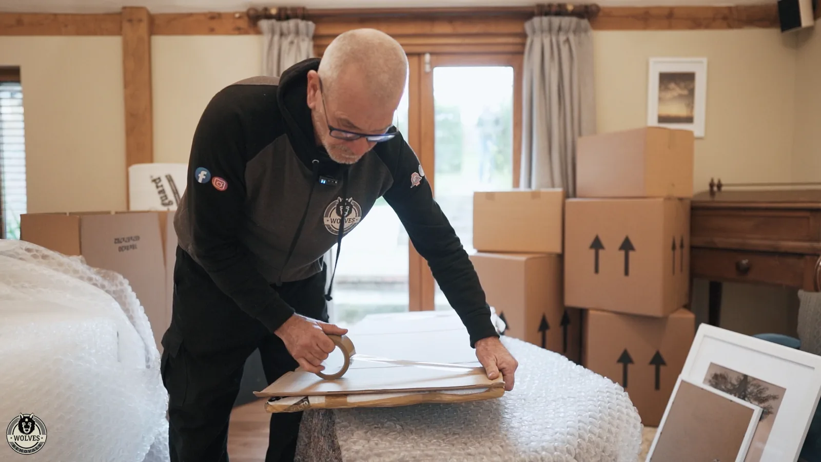 Wrapping a table top in a protective cover in Pulborough