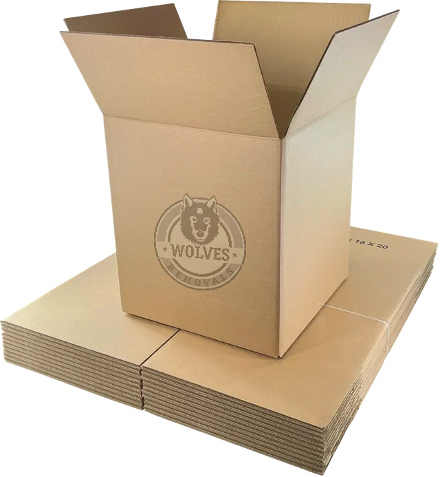 Large double-walled moving box on a stack of flat-packed cartons